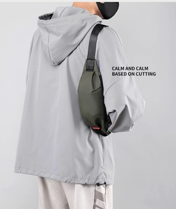 Close-up of military green minimalist chest bag with sleek matte nylon fabric detail