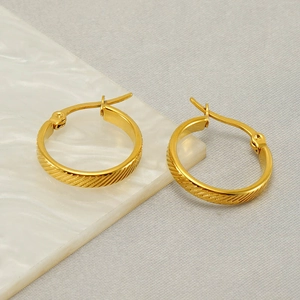 Elegant gold-plated titanium steel hoop earrings with textured diagonal stripe engraving