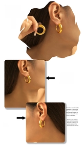 Detail of chunky 18k gold plated C-shape hoop earrings with a polished glossy finish