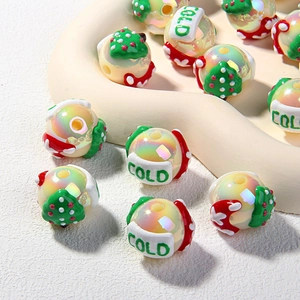 Macro shot of hand-painted acrylic beads with festive patterns for DIY craft jewelry