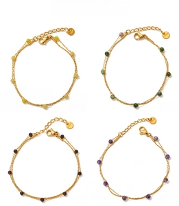 Detail of double-layer stainless steel anklets with colorful beads and lobster clasp