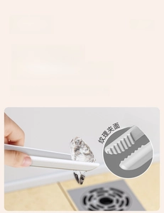 Detail of the non-slip serrated tweezers head for hair removal from bathroom drains