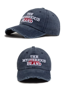 Detail of distressed navy cotton baseball cap with The Mysterious Island embroidery