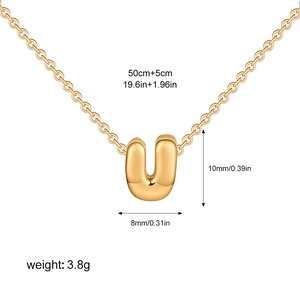 Detailed view of golden bubble letter U pendant with dimensions 10x8mm and 55cm chain