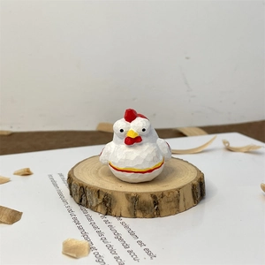Handcrafted wooden chicken sculpture with visible carving texture on a rustic timber base