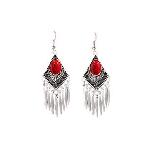 Bohemian retro silver drop earrings with red stones and metallic tassels on white backdrop