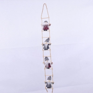 Detail view of four Christmas gnomes climbing a hemp rope ladder for festive wall decoration