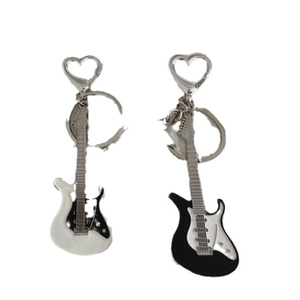 Retro electric guitar keychains in black and white with heart-shaped metal clips