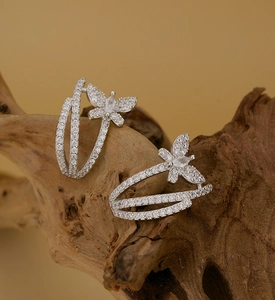 Detailed macro view of S925 silver butterfly earrings with sparkling cubic zirconia stones