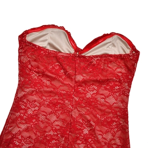Detailed close-up of red floral lace fabric texture on a sexy bodycon two-piece dress set