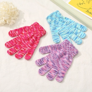 Detailed knit texture of gradient pink, blue, and purple winter gloves for kids