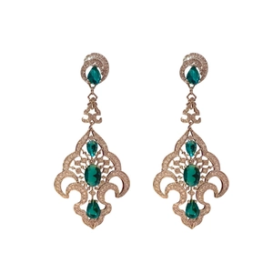 Vintage tree-shaped gold earrings with green gemstones and diamonds on white background
