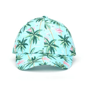 Detailed view of pink flamingo and green palm tree patterns on a tropical baseball cap