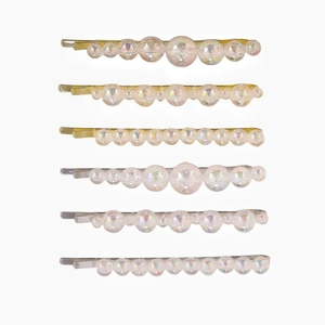 Set of 6 handmade colorful pearl hair clips with gold and silver metal bases in white background