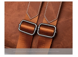 Close-up of adjustable straps with silver-grey metal buckles on a dark brown backpack