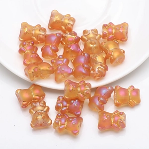 Macro detail of 12x14mm colorful iridescent 3D bear crystal beads for DIY jewelry making