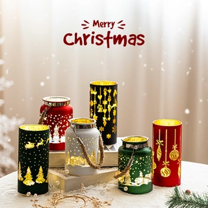 Christmas lantern set with laser-cut patterns on snow surface for holiday table decor
