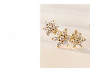 Close-up of S925 silver flower stud earrings with three-layer gold plating and zircons