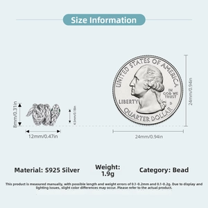 S925 sterling silver snake charm dimensions 12mm x 8mm shown next to a quarter coin