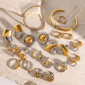 Two-tone gold and silver stainless steel jewelry set with rings, bangles and earrings