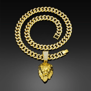 Close-up of golden lion head pendant with crystal rhinestones on a Cuban link chain