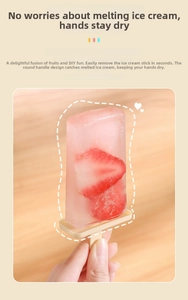 Detail of homemade strawberry popsicle in a pink mold with a drip-guard handle design