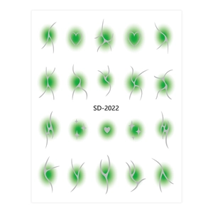 Detail view of aura nail art stickers featuring green gradient circles and silver star patterns