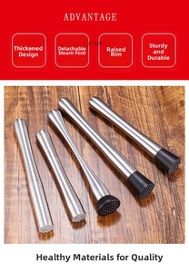 Macro detail of stainless steel muddlers with textured heads on a wooden table