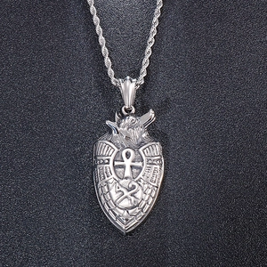 Detailed relief of wolf head and cross hammers on silver stainless steel shield pendant
