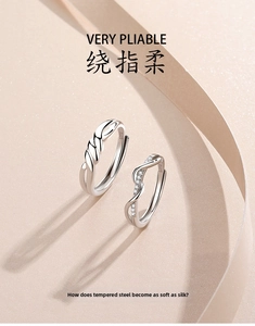 Detailed close-up of S925 sterling silver couple rings with knot texture and diamond inlays
