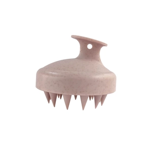 Detail view of pink wheat straw hair scalp brush with ergonomic handle and hanging hole