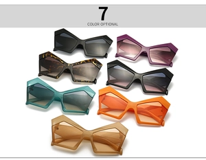 Flat lay of geometric polygonal oversized sunglasses in seven diverse fashion colors
