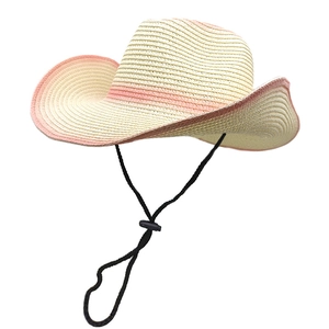 Detailed weave of beige straw sun hat featuring a pink gradient wide brim and chin strap