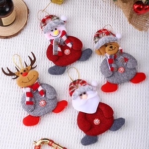 Christmas ornaments set featuring Santa, snowman, bear and reindeer fabric dolls on white background