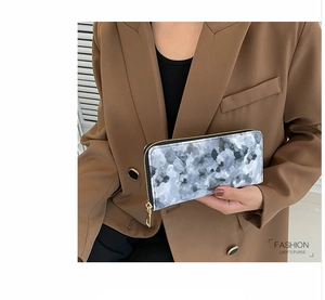 Fashionable lady's long purse with grey marble pattern and premium gold zipper detail