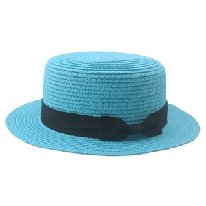Close-up of sky blue boater straw hat featuring a black grosgrain ribbon and bow detail