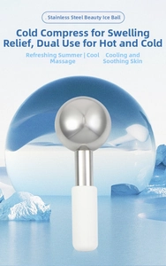 Detail of stainless steel ice globe massager with anti-slip handle for cold and heat therapy