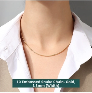 Detail of 1.3mm textured snake bone chain in 18K gold plated titanium steel on neck