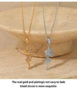 Detailed view of fairy pendants in gold and silver finish with PVD plating and zircon