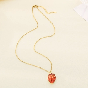 Golden titanium necklace with a detailed red strawberry pendant and crystal embellishments