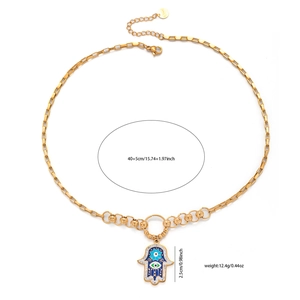 Close-up of golden Hamsa Hand pendant with evil eye blue enamel and S.Steel chain