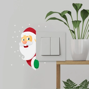Detailed view of a cartoon Santa Claus light switch sticker in a cozy home setting