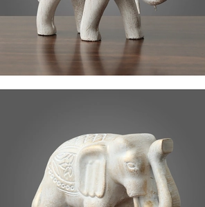 Détail rapproché d'une statue d'éléphant avec finition ivoire-or et motifs mandala