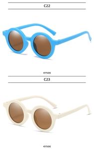 Detail view of round frame kids sunglasses in light blue and cream white color options