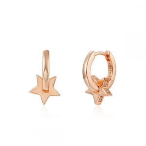 Close-up of S925 rose gold star drop earrings with polished metallic texture