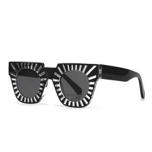 Fashionable square frame sunglasses with silver metallic sunburst detail on a black frame