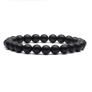 Close-up of matte black natural obsidian beaded bracelet with uniform round stones