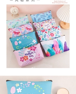 Macro detail of various printed waterproof PU makeup bags with secure metal zippers