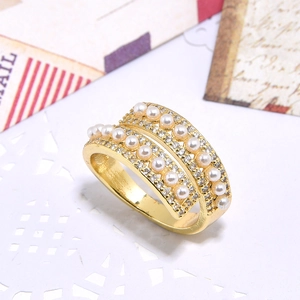 Golden double-layer open ring featuring white pearls and sparkling cubic zirconia crystals