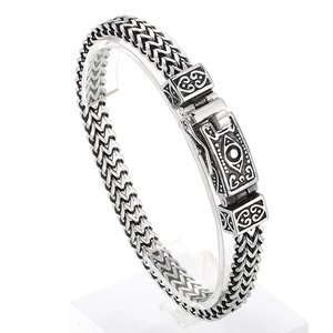 Retro punk titanium steel skull bracelet with double-row chain and vintage relief clasp